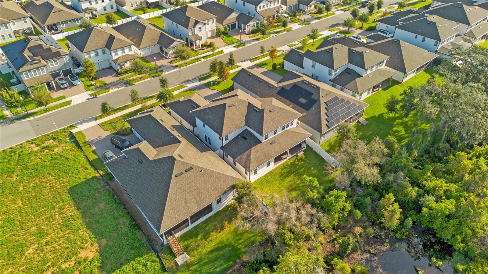 Wide aerial perspective shows the propertys location within the surrounding neighborhood.