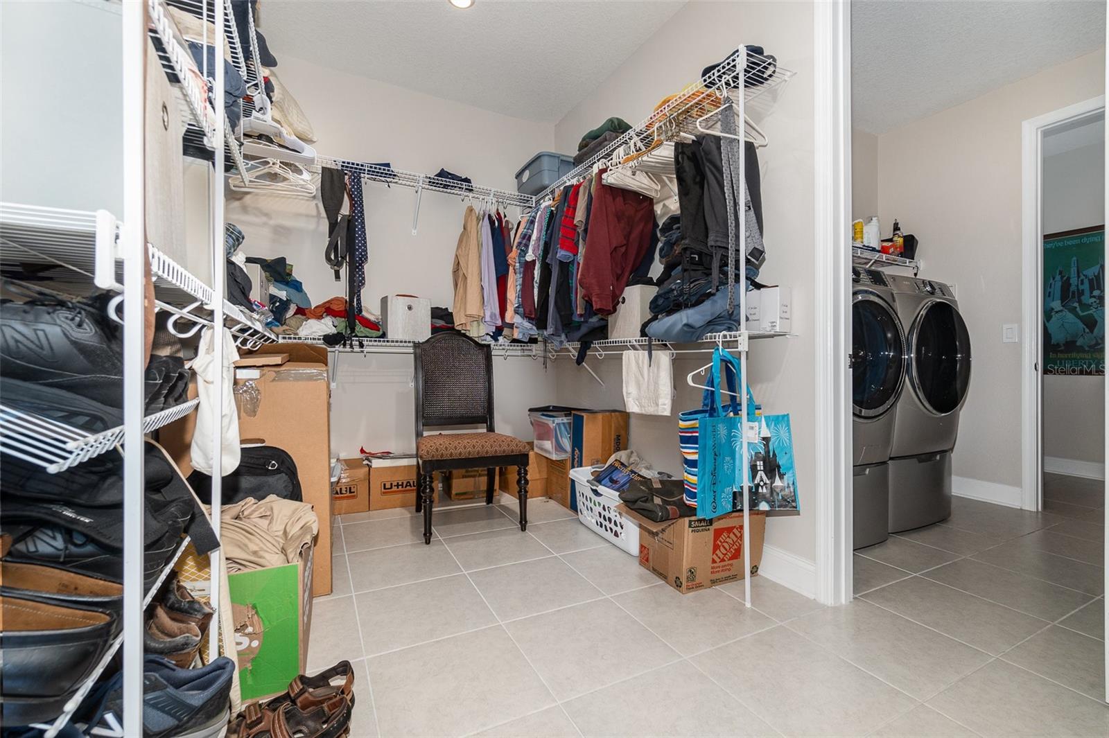 Huge Primary Bedroom Walk in Closet that connects to Laundry Room. Laundry Room connects to hallway with 2 other bedrooms and a bath