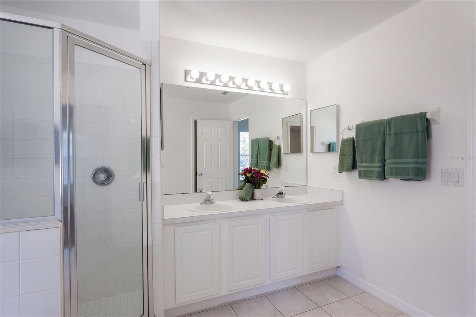 En suite bath -- private water closet is out of view