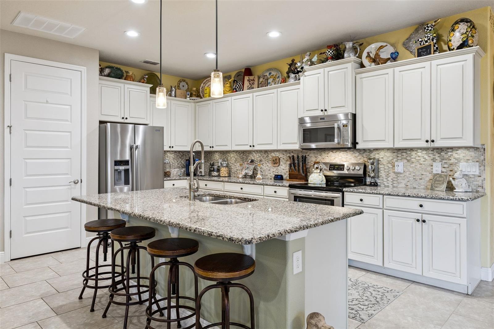 Upgraded Kitchen with Glazed Cabinetry and Large Island!