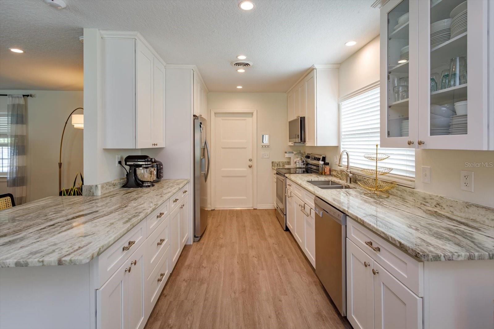 Beautifully upgraded 9 x 13 kitchen with shaker cabinets and stone countertops Beautifully upgraded 9 x 13 kitchen with shaker cabinets and stone countertops