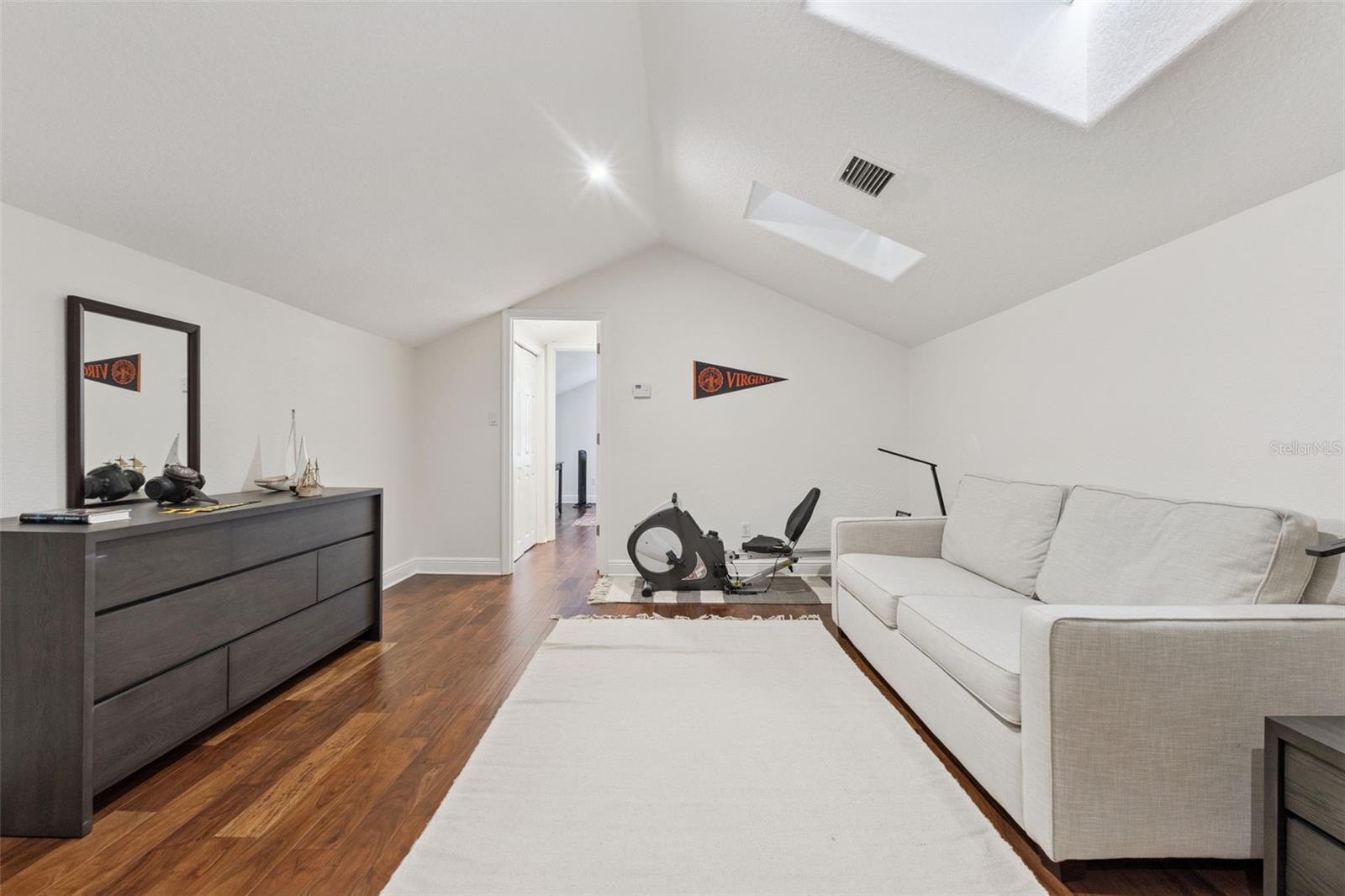 Second floor private bedroom suite with living room, bath and bedroom with skylights.