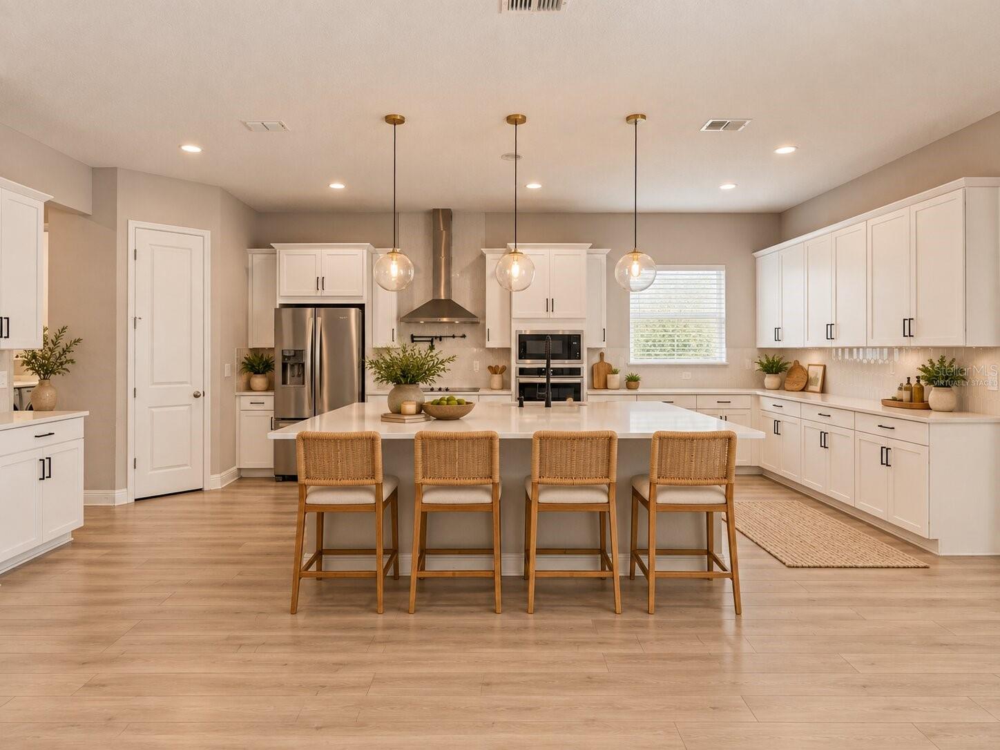 Virtually Staged! Spacious kitchen and dining area designed for entertaining.