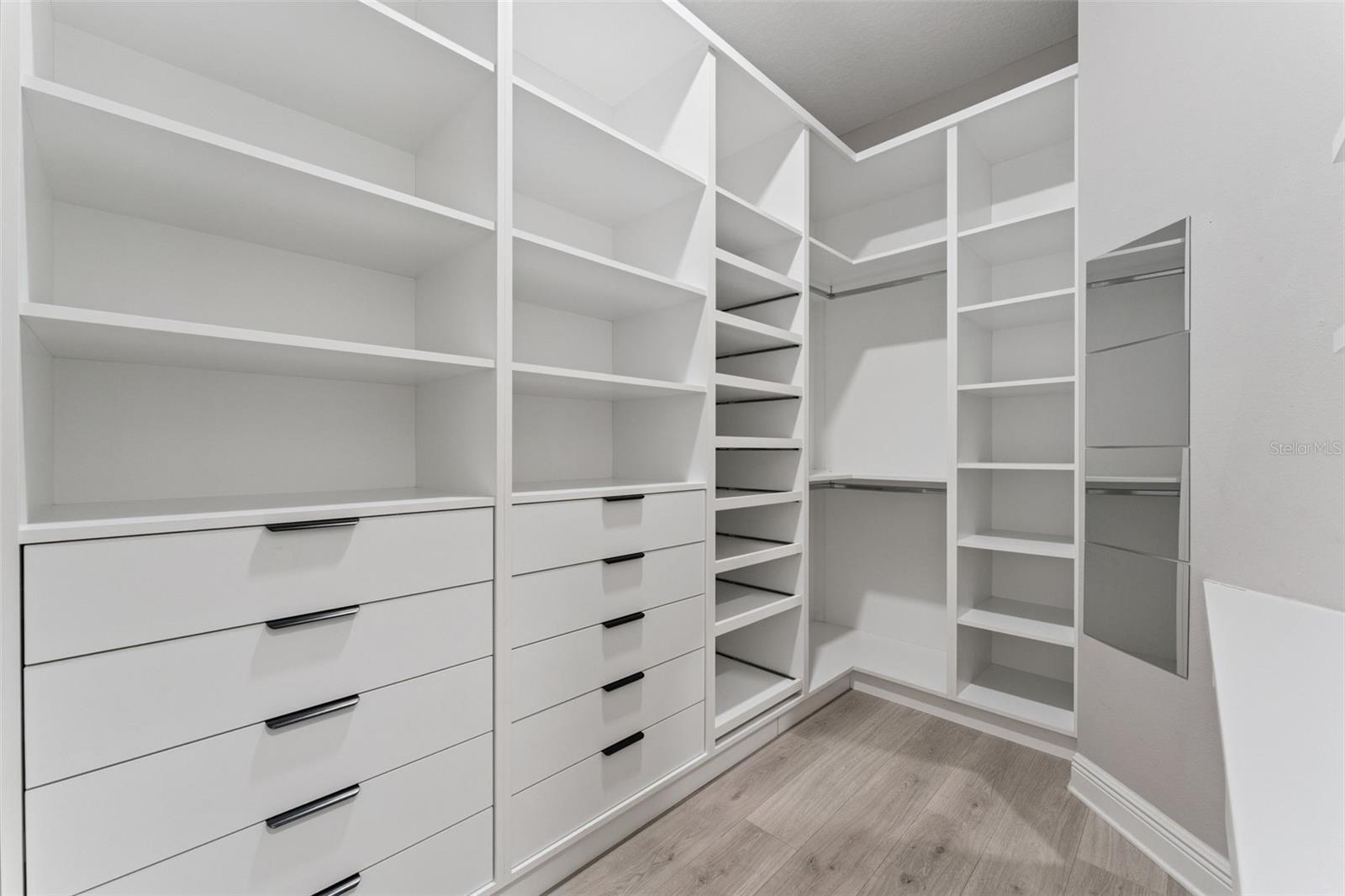 Large walk-in closet offering excellent storage and organization space.