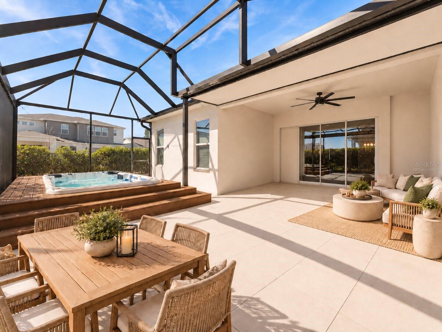 Virtually Staged! Screened outdoor living area perfect for relaxing or entertaining.