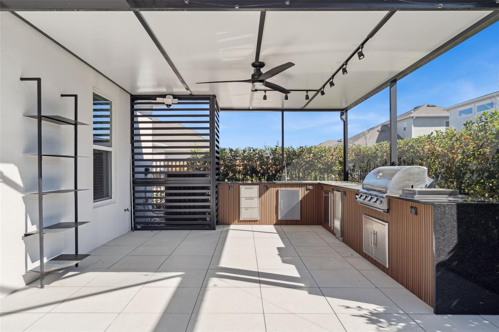 Covered screened lanai with plenty of room for outdoor seating and dining.