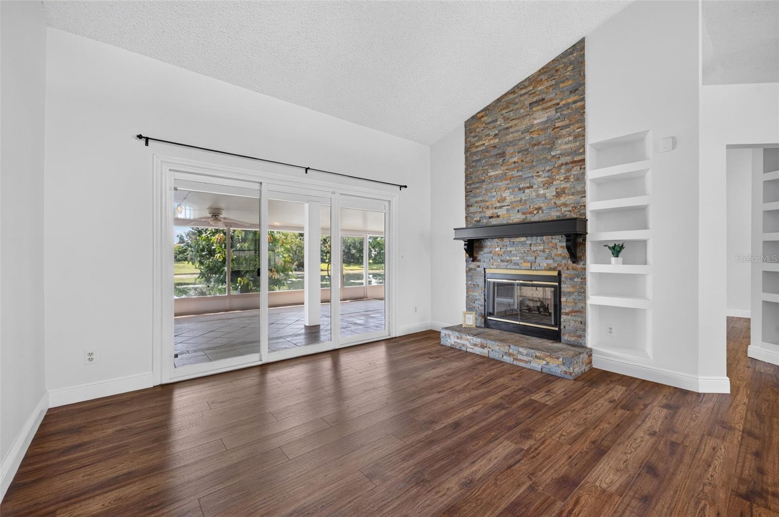 The custom stone work on the wood burning fireplace adds style and warmth to the room.