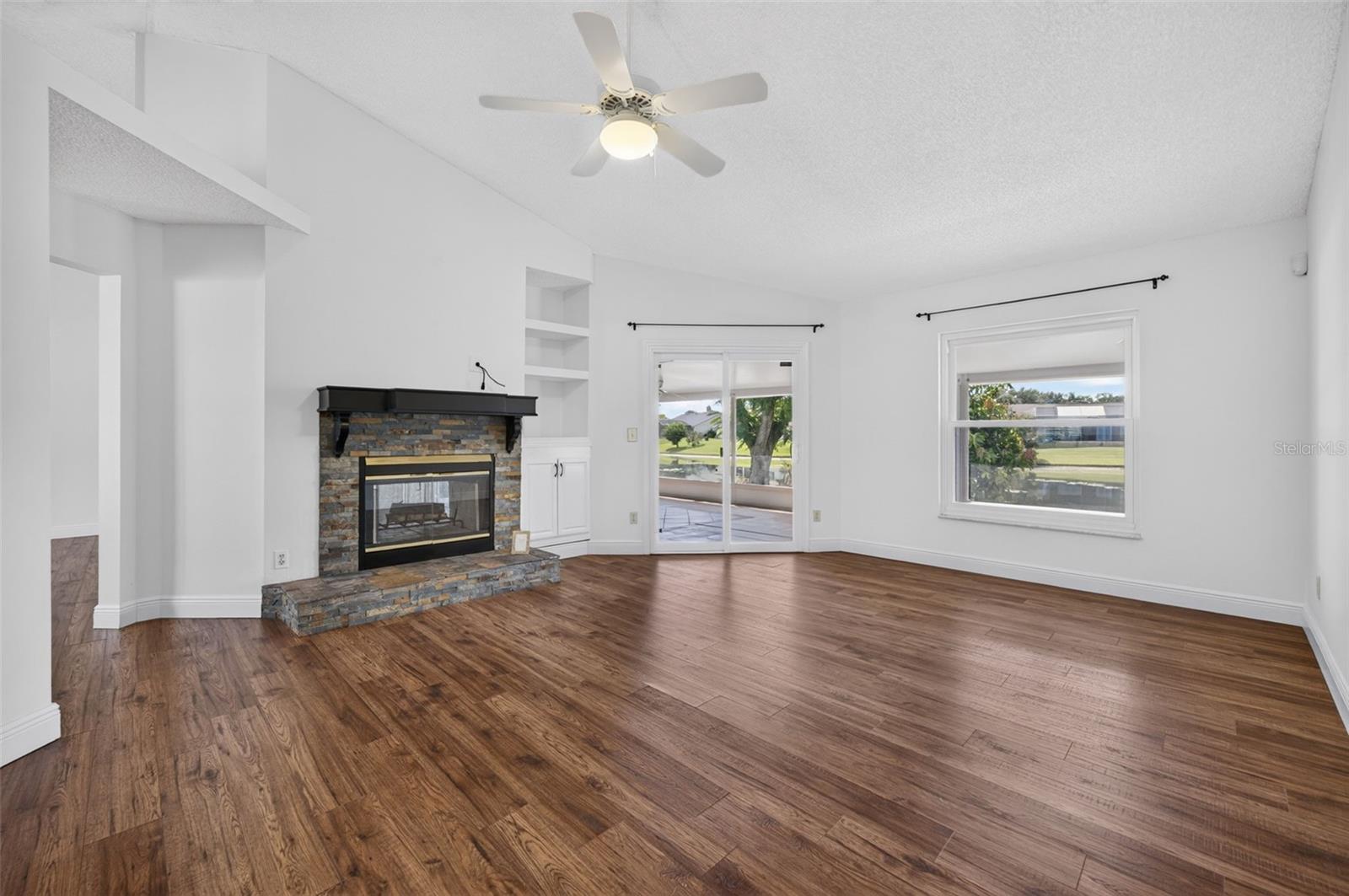 The family room that also features beautiful lake views and the cozy fireplace!