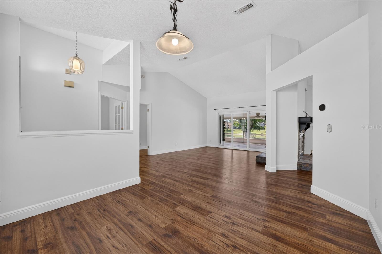 The formal dining room that opens to the formal living room.