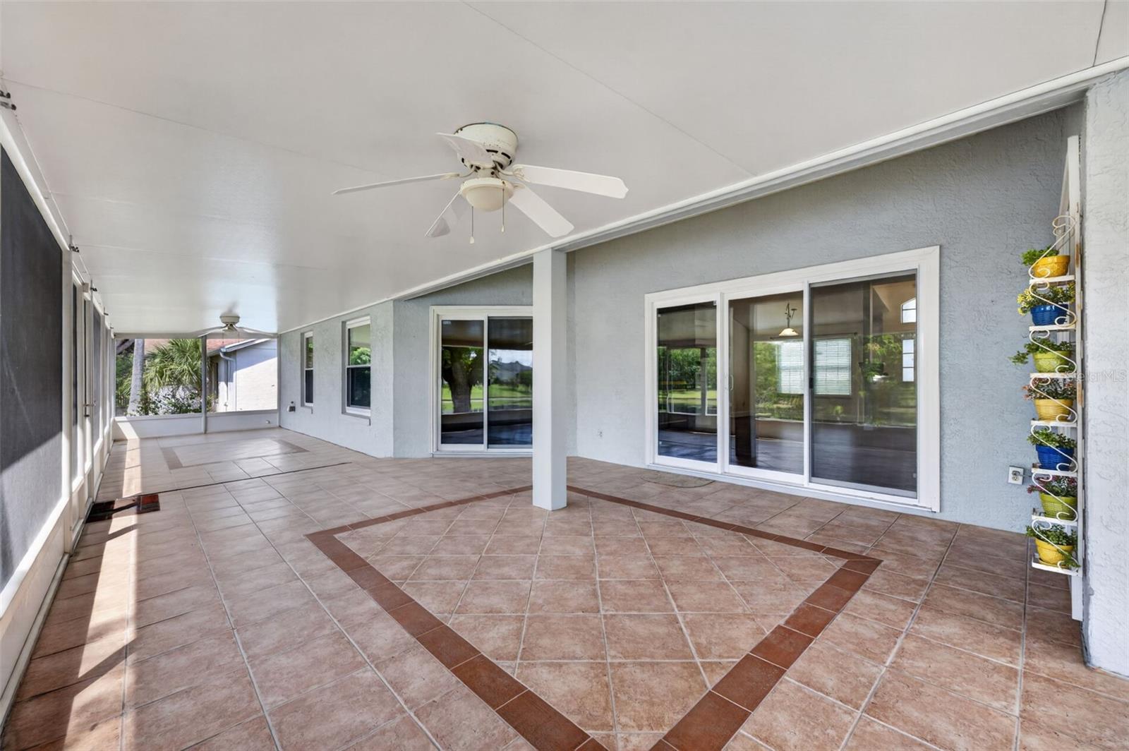 Back Patio with sliders from the living room, family room, and primary retreat.