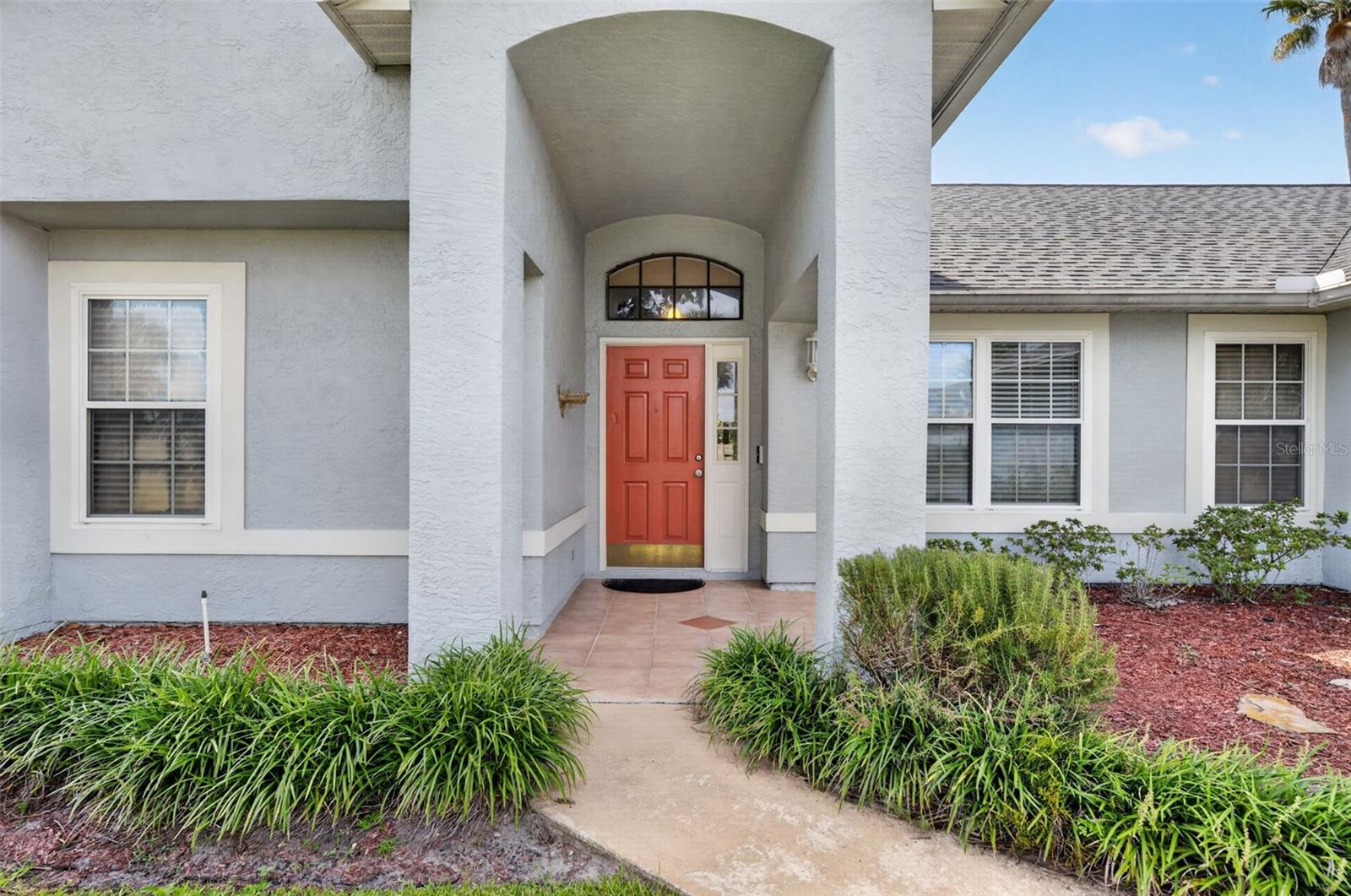 Mature landscaping greets you at all corners of this home.