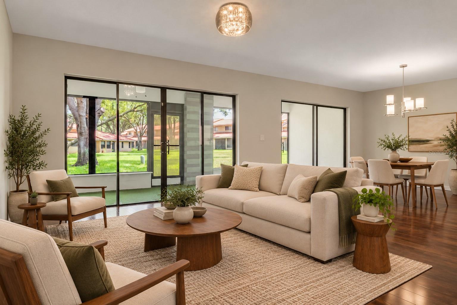 Large sliding glass doors connect the living area to the screened lanai.
