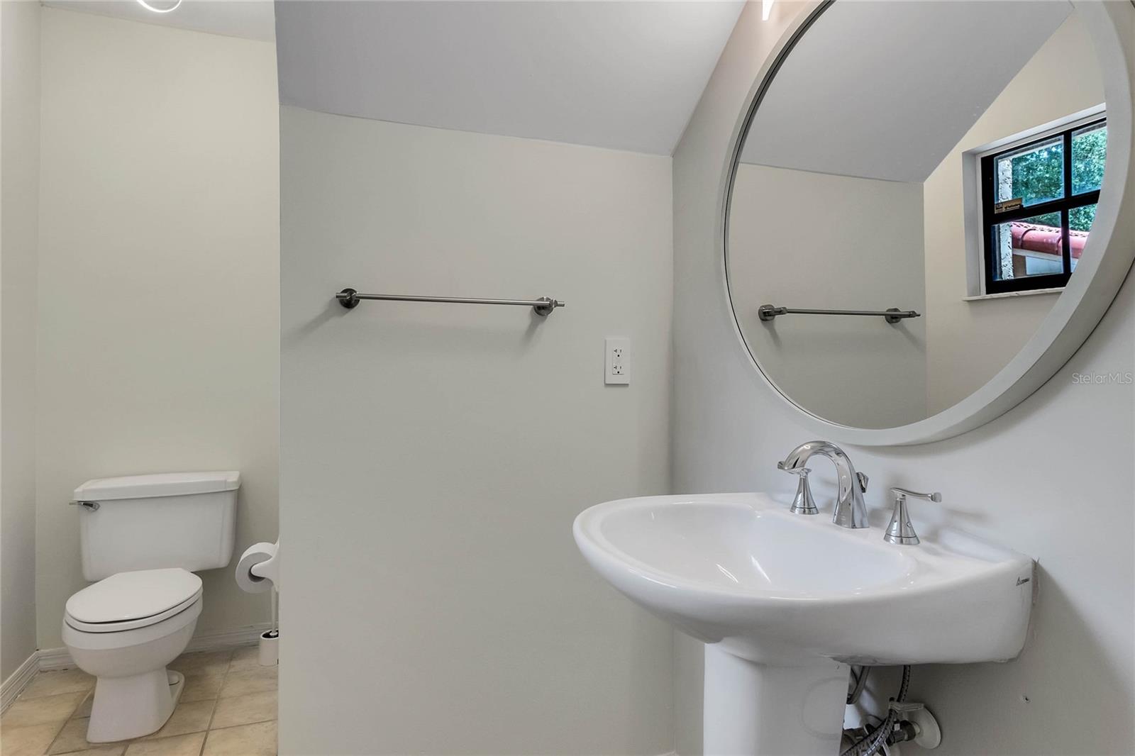 Guest half bathroom downstairs.
