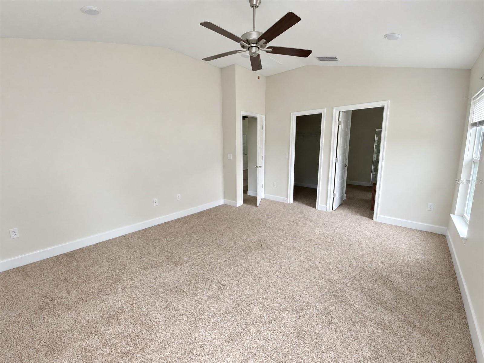 Primary Bed Room. View towards En-suite and Walk-In Closet