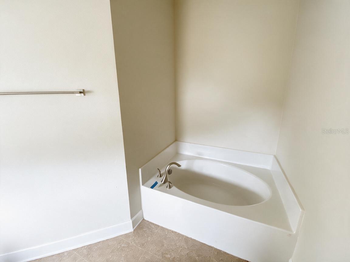 Primary En-suite with Double Sink, Shower and Soaking Tub.