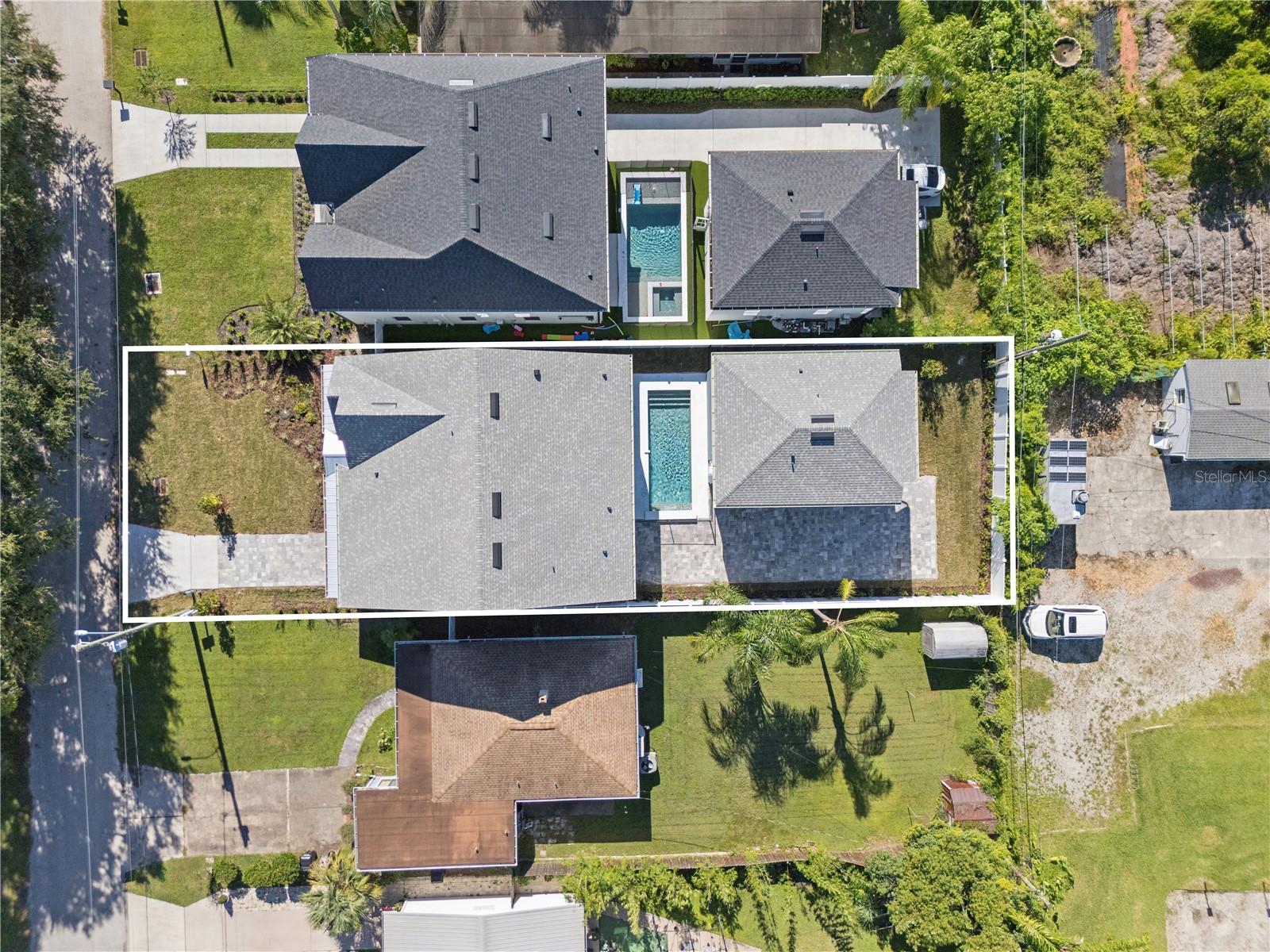An overhead view shows the home, pool, and rear garage; neighboring properties are also pictured.