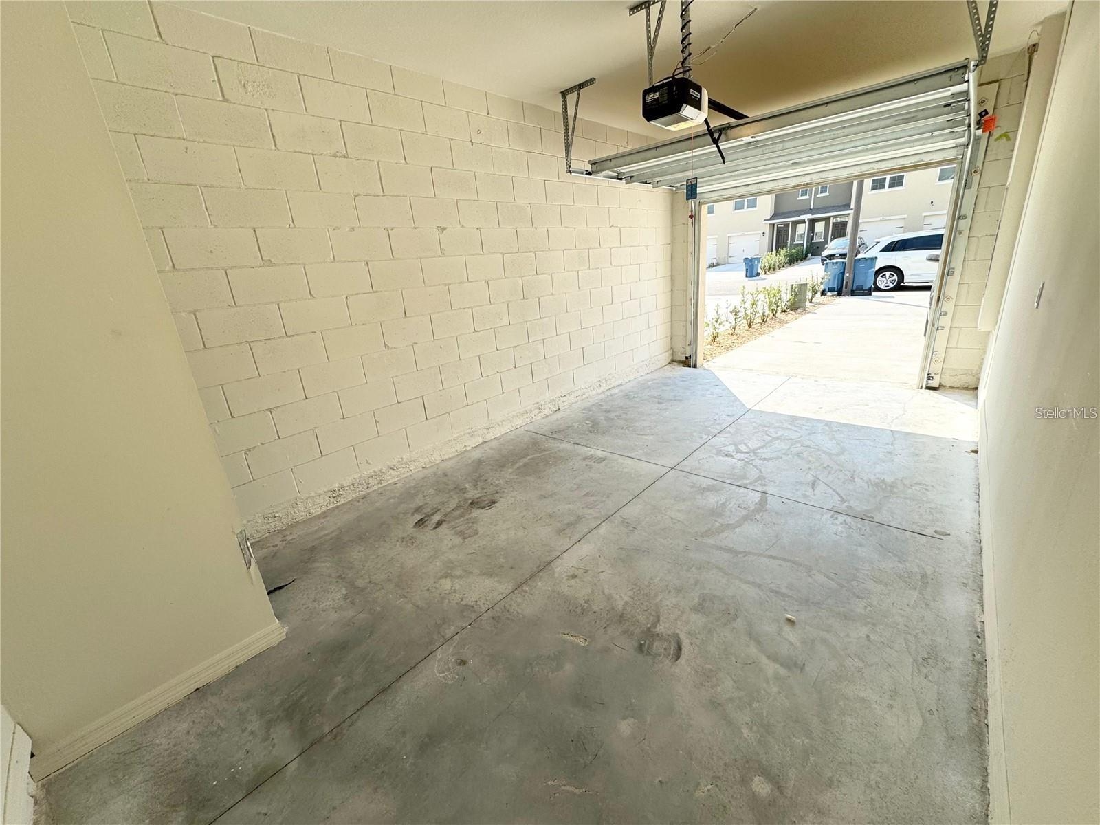 View from exit/entrance door, interior of garage toward parking area.