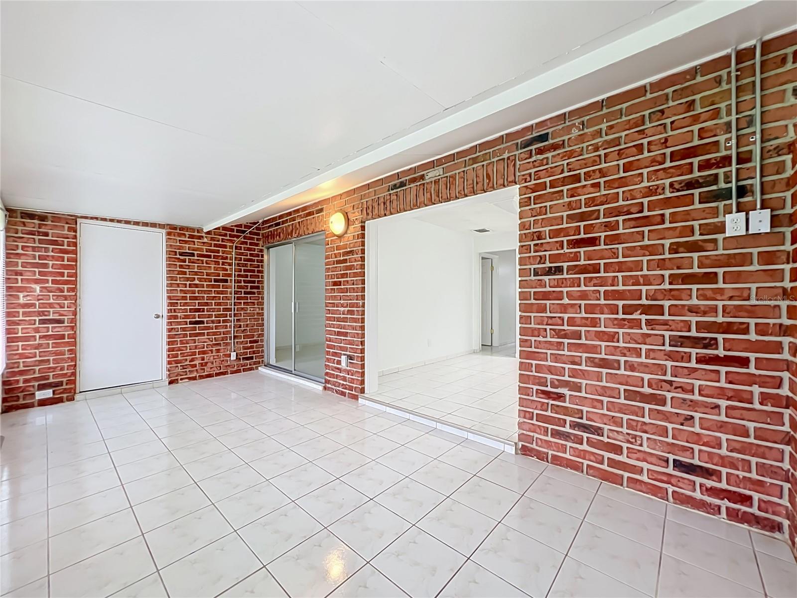 One of the home's highlights  a spacious Florida room offering endless possibilities.