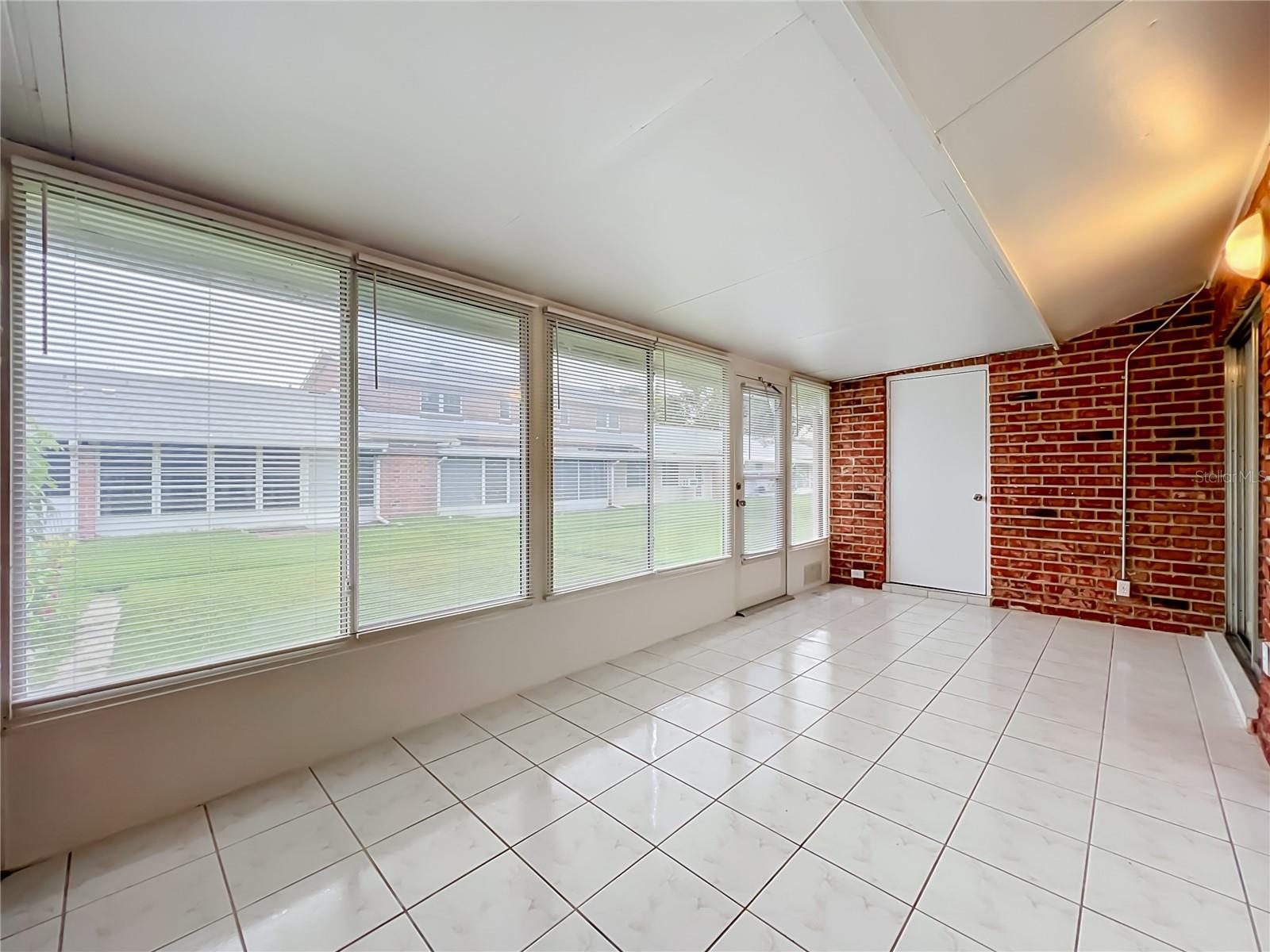 Florida room connects conveniently to the main living area and kitchen.