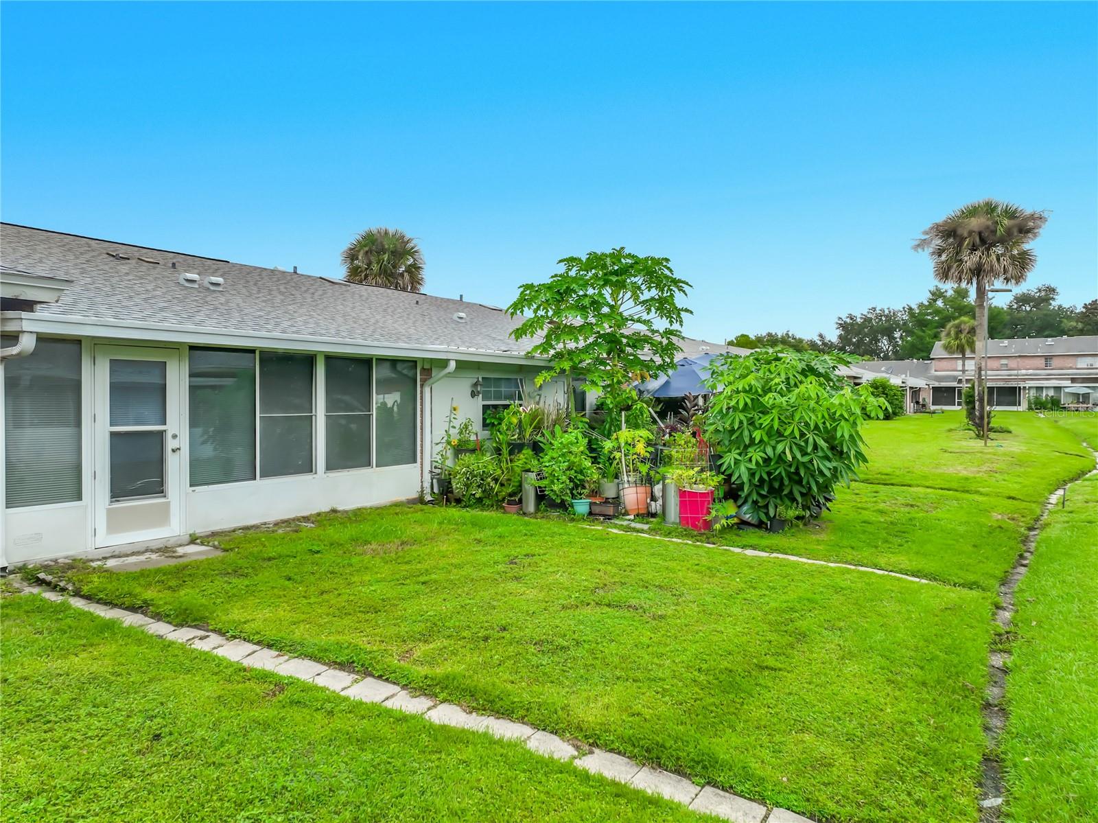Green space just outside the home adds to the open and peaceful setting.
