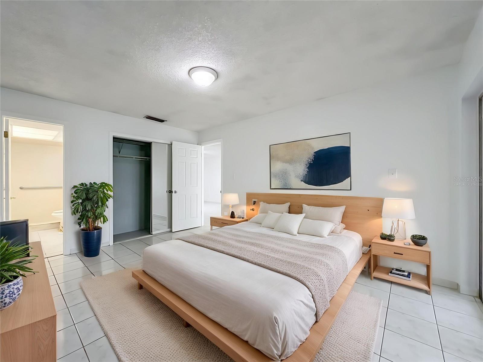 Virtually staged primary bedroom showcasing the generous room size and possibilities.