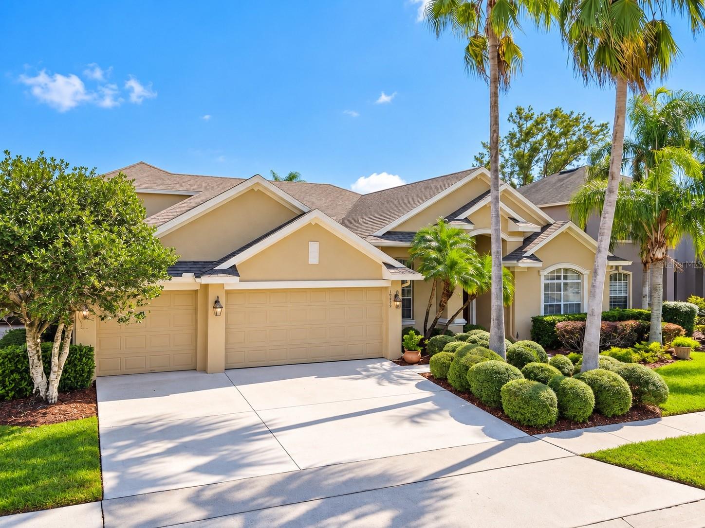 WELCOME HOME TO THIS STUNNING 5-BEDROOM, 3-BATHROOM POOL HOME IN THE DESIRABLE GATED COMMUNITY OF EASTWOOD! Featuring a SPACIOUS 3-CAR GARAGE, beautiful architectural details, lush tropical landscaping, mature palm trees, and meticulously manicured grounds, this home offers EXCEPTIONAL CURB APPEAL and a warm, inviting entrance that is sure to impress! WELCOME HOME TO THIS STUNNING 5-BEDROOM, 3-BATHROOM POOL HOME IN THE DESIRABLE GATED COMMUNITY OF EASTWOOD! Featuring a SPACIOUS 3-CAR GARAGE, beautiful architectural details, lush tropical landscaping, mature palm trees, and meticulously manicured grounds, this home offers EXCEPTIONAL CURB APPEAL and a warm, inviting entrance that is sure to impress!