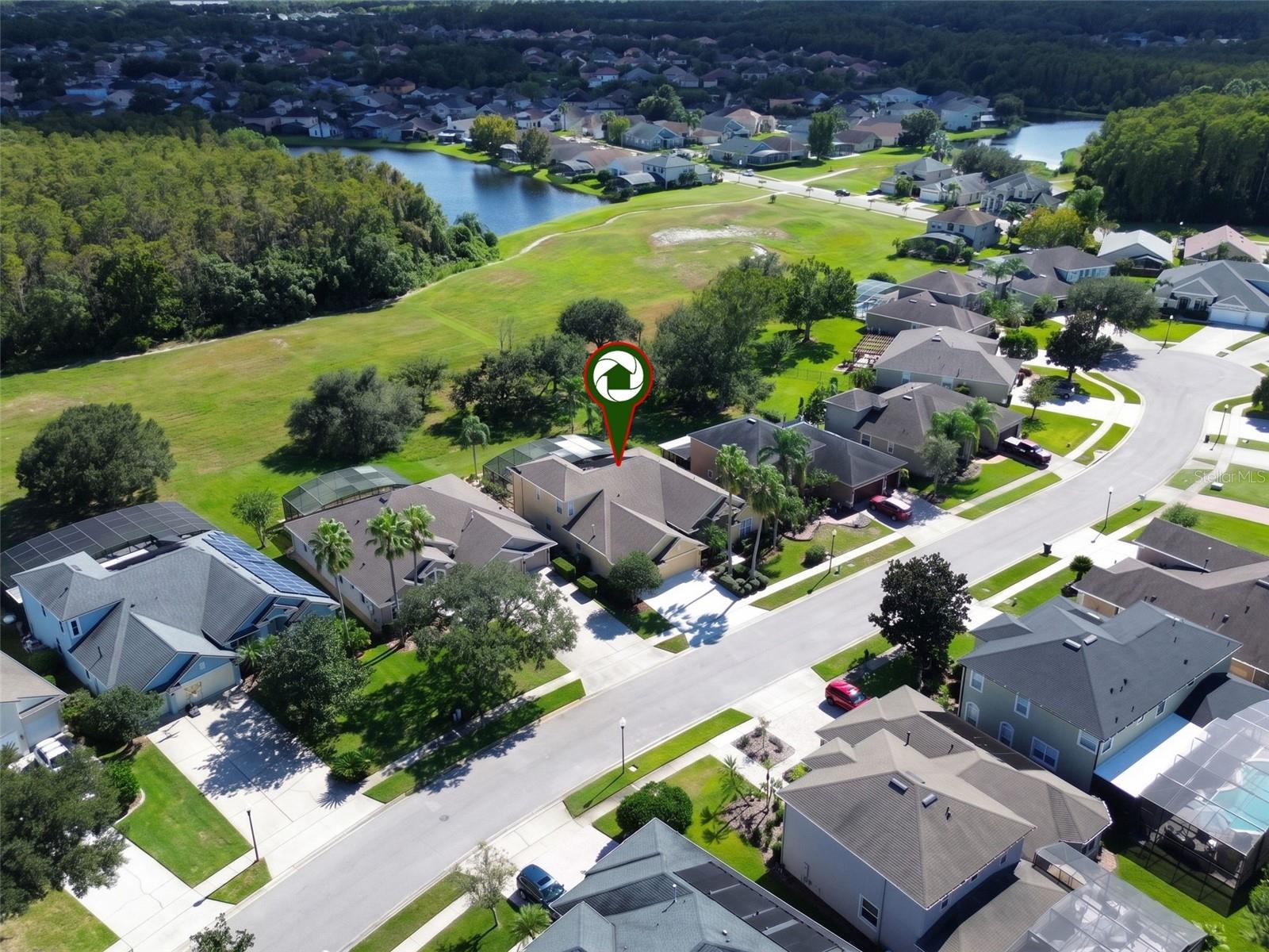 BEAUTIFUL AERIAL VIEW OF THIS STUNNING POOL HOME NESTLED ON A QUIET CUL-DE-SAC IN THE HIGHLY DESIRABLE GATED COMMUNITY OF EASTWOOD!