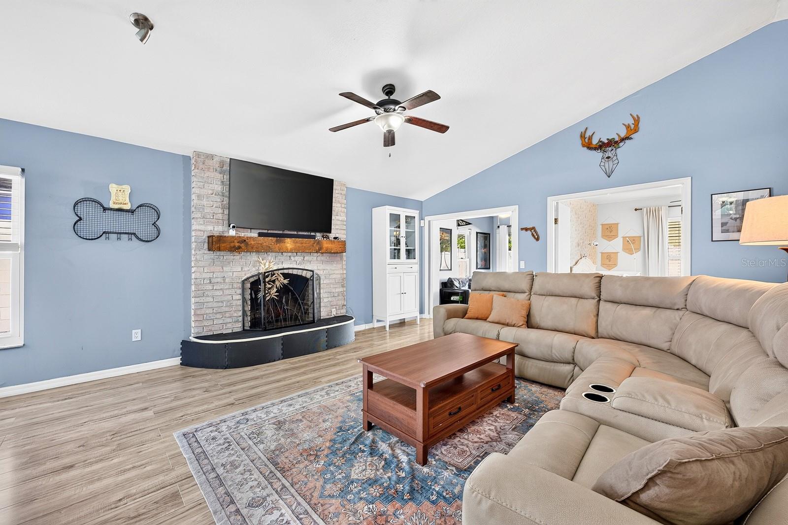 Living area is complete with a fireplace.
