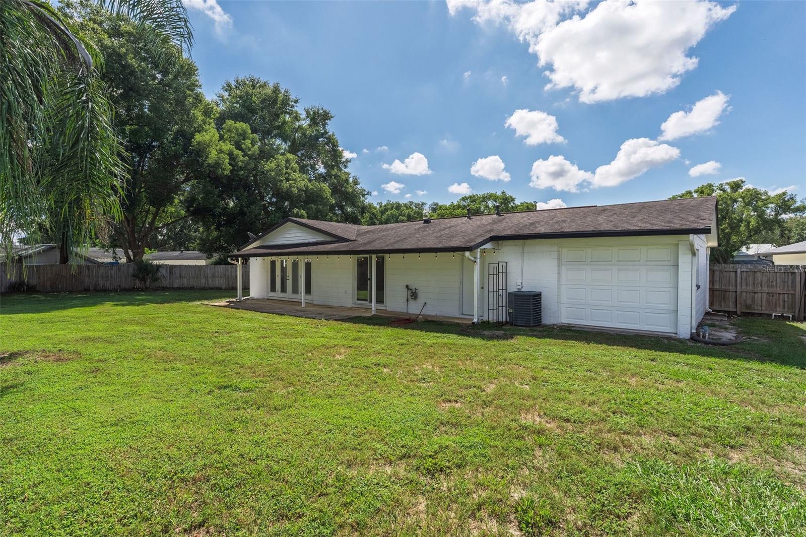 3rd garage door leading to backyard