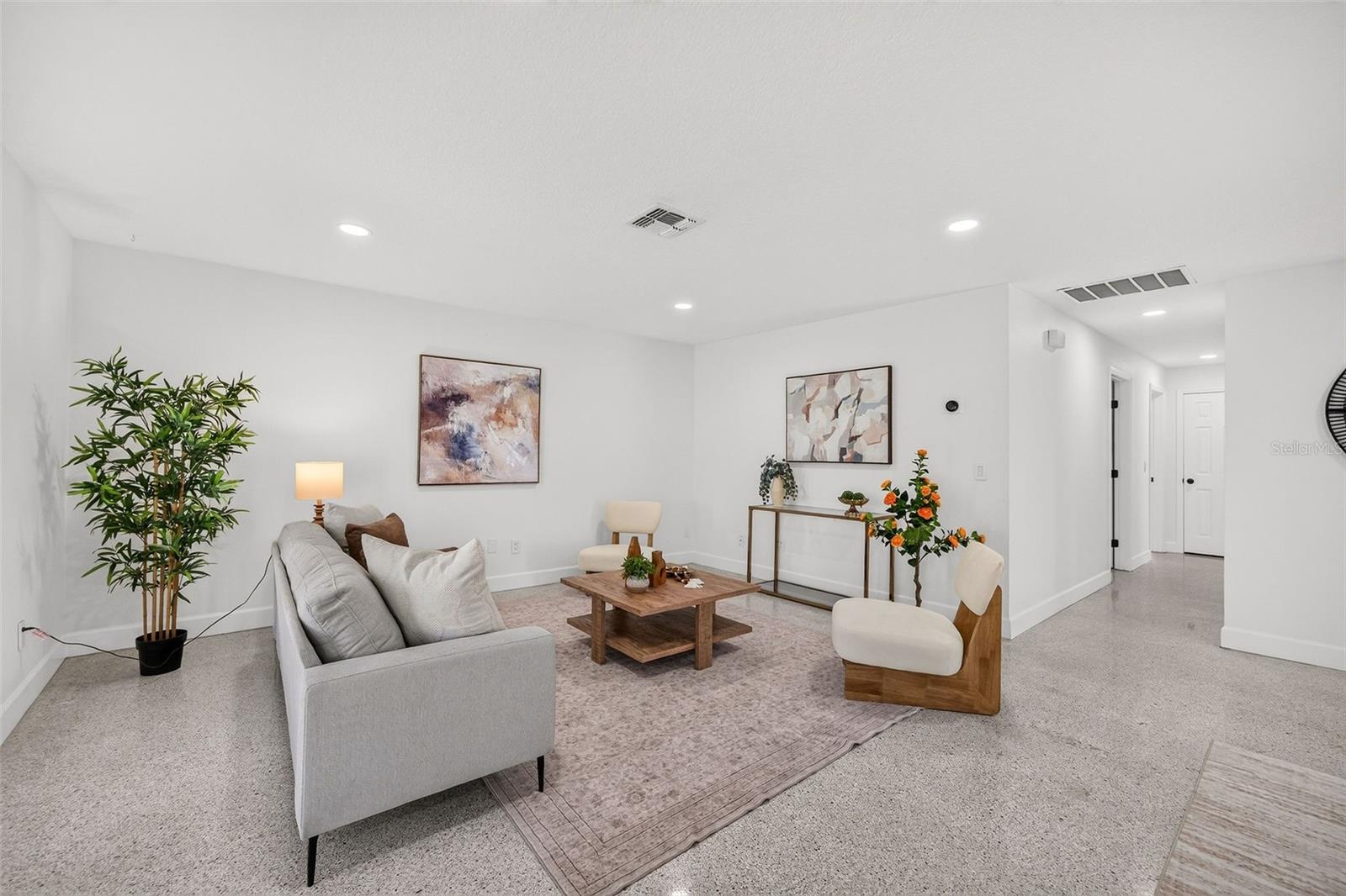 Living room with hallway to 3 bedrooms