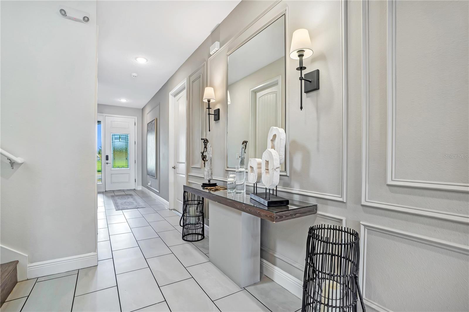 Beautiful architectural millwork, decorative wall detailing, and designer accents create a refined arrival experience