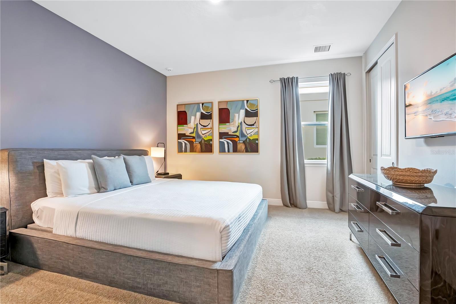 A welcoming 1st floor guest suite with understated finishes, comfortable furnishings, and natural light