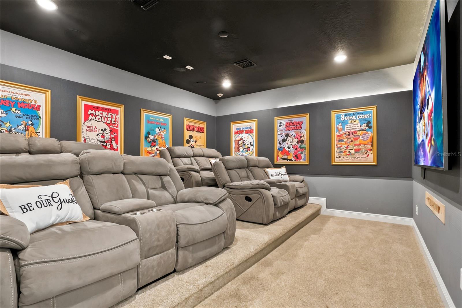 The Wonderful World of Disney Theater - plush reclining seating, custom architectural details, and immersive lighting