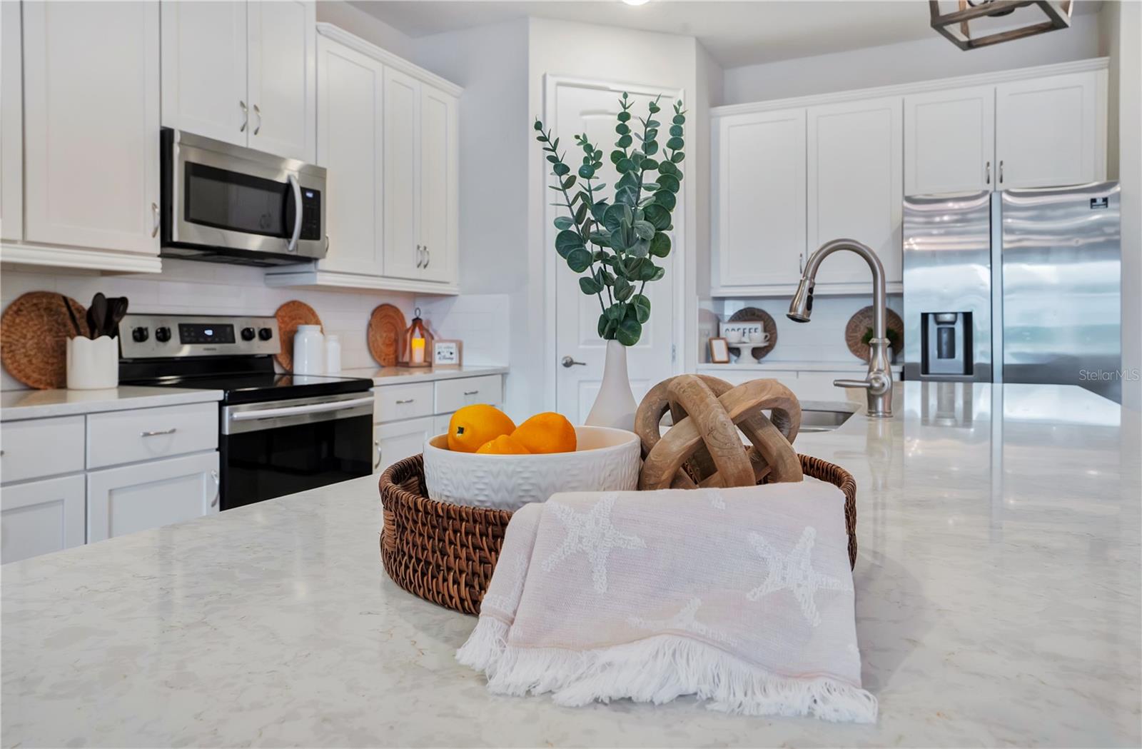 Timeless subway tile, white shaker cabinetry, and elegant granite surfaces