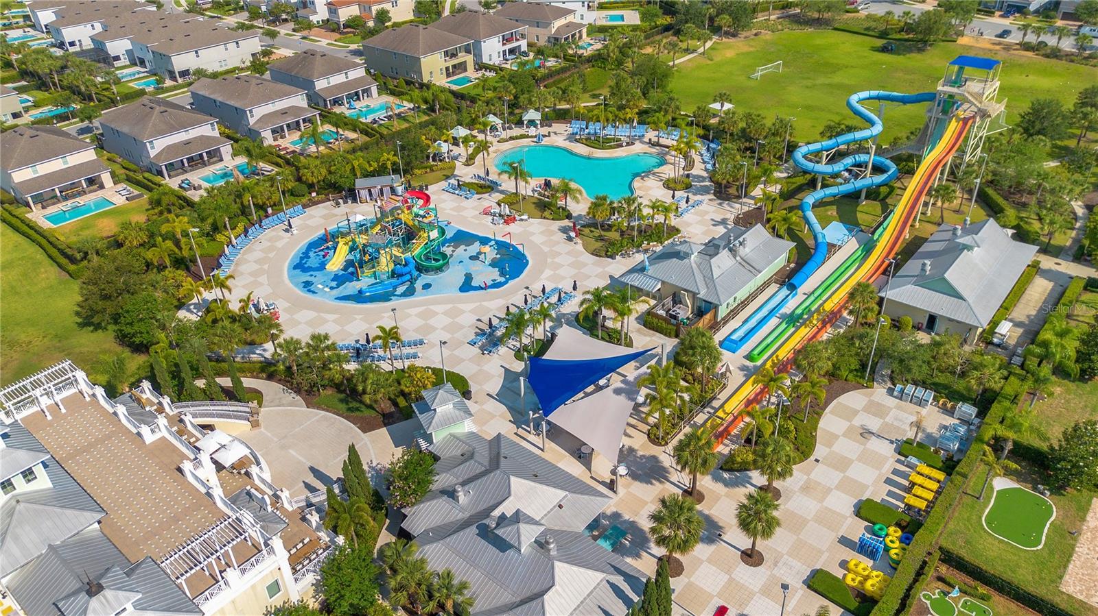 A tropical resort experience with sparkling pools, waterslides, and inviting gathering spaces