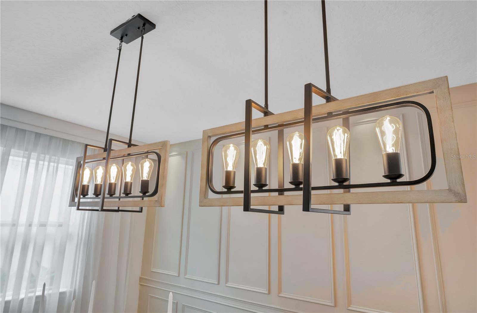 Statement chandeliers provide a striking finishing touch to the dining room
