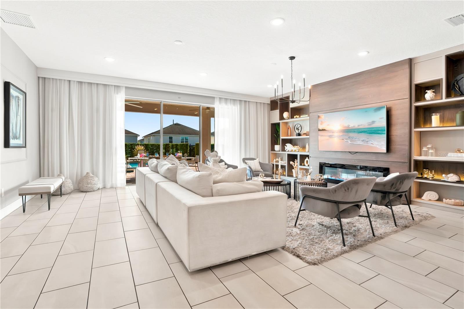 Sophisticated comfort, custom draperies, and seamless indoor-outdoor views