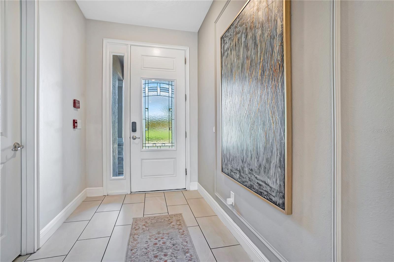 A welcoming entry sets the tone with elegant finishes, and a bright, sophisticated introduction to the home