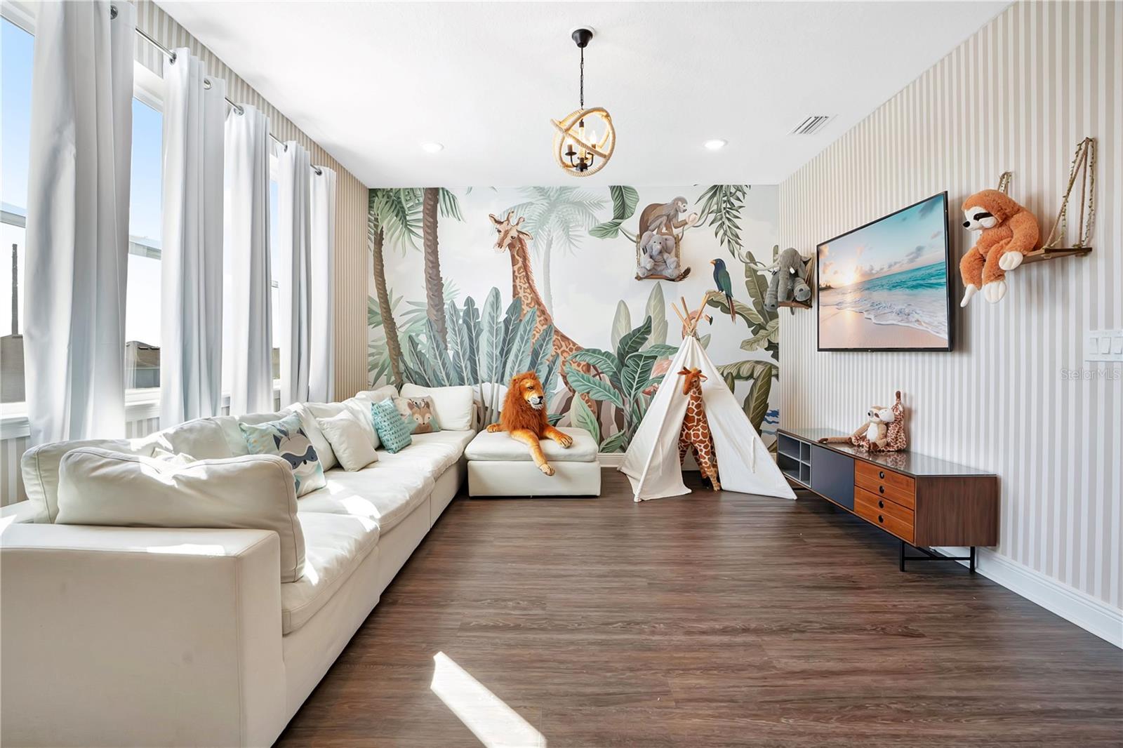 The Jungle Book Lounge - a whimsical upstairs retreat with colorful murals and inviting seating