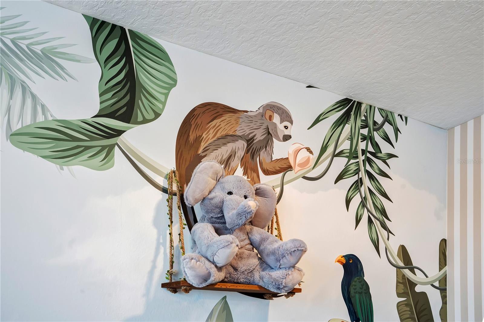 Beautifully illustrated jungle-inspired murals add personality and imagination