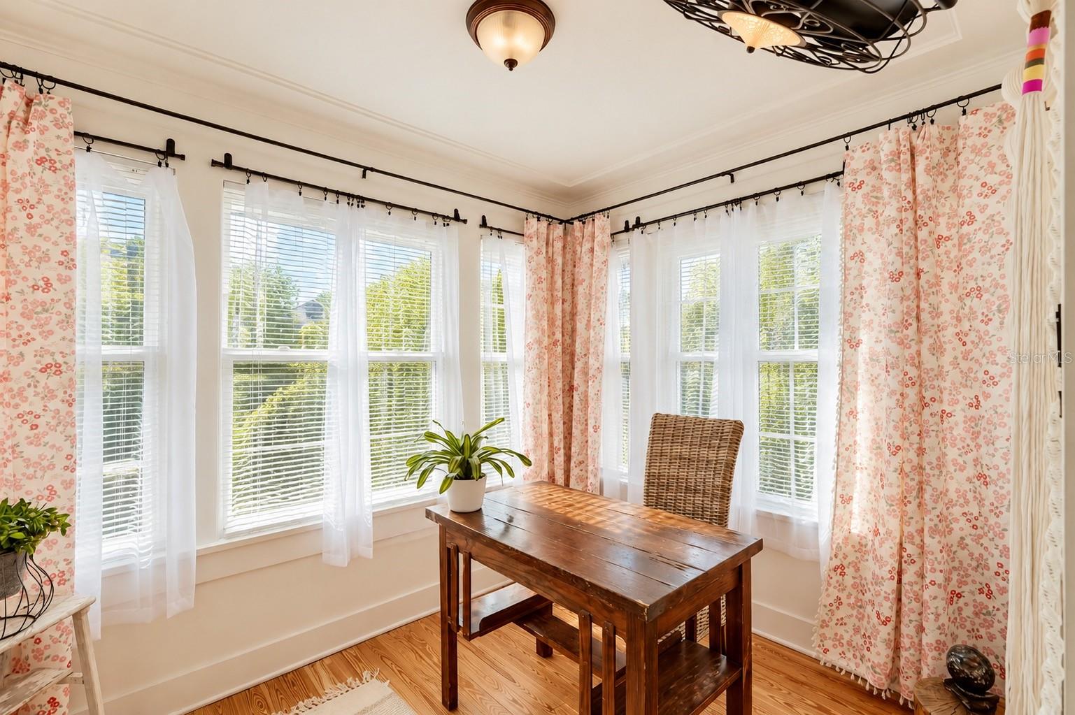 Bright and inviting SUNROOM featuring an abundance of natural light, beautiful hardwood floors, and DOUBLE FRENCH DOORS. Currently used as a home office, this versatile space offers endless possibilities as a guest room, reading retreat, or cozy sitting area! Bright and inviting SUNROOM featuring an abundance of natural light, beautiful hardwood floors, and DOUBLE FRENCH DOORS. Currently used as a home office, this versatile space offers endless possibilities as a guest room, reading retreat, or cozy sitting area!