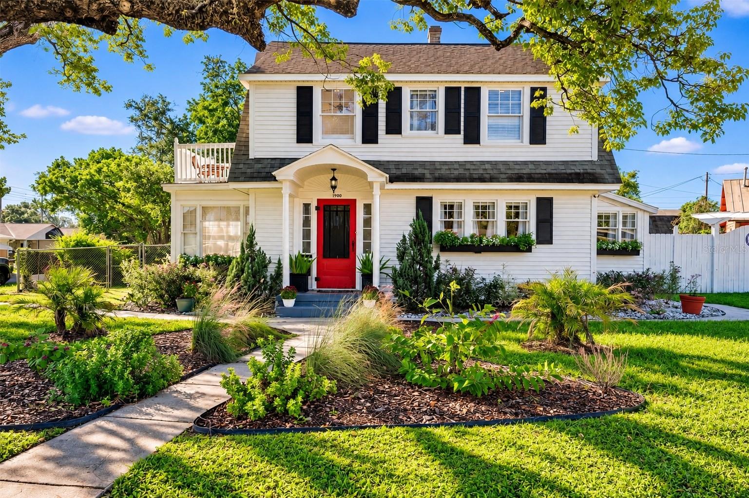 CHARMING TWO-STORY HOME SITUATED ON AN EXPANSIVE .34-ACRE LOT WITH NO HOA! Beautiful white siding, contrasting black shutters, and a welcoming red front door create picture-perfect curb appeal. A covered front entry, charming window flower boxes, and mature landscaping add warmth and character, while a majestic oak tree provides beautiful natural shade. The spacious .34-ACRE PROPERTY is a gardener's paradise, featuring a wonderful variety of EDIBLE FRUIT TREES, PLANTS, AND HERBS, creating your very own backyard oasis! Enjoy the beauty of nature, the joy of homegrown harvests, and the freedom of NO HOA! CHARMING TWO-STORY HOME SITUATED ON AN EXPANSIVE .34-ACRE LOT WITH NO HOA! Beautiful white siding, contrasting black shutters, and a welcoming red front door create picture-perfect curb appeal. A covered front entry, charming window flower boxes, and mature landscaping add warmth and character, while a majestic oak tree provides beautiful natural shade. The spacious .34-ACRE PROPERTY is a gardener's paradise, featuring a wonderful variety of EDIBLE FRUIT TREES, PLANTS, AND HERBS, creating your very own backyard oasis! Enjoy the beauty of nature, the joy of homegrown harvests, and the freedom of NO HOA!