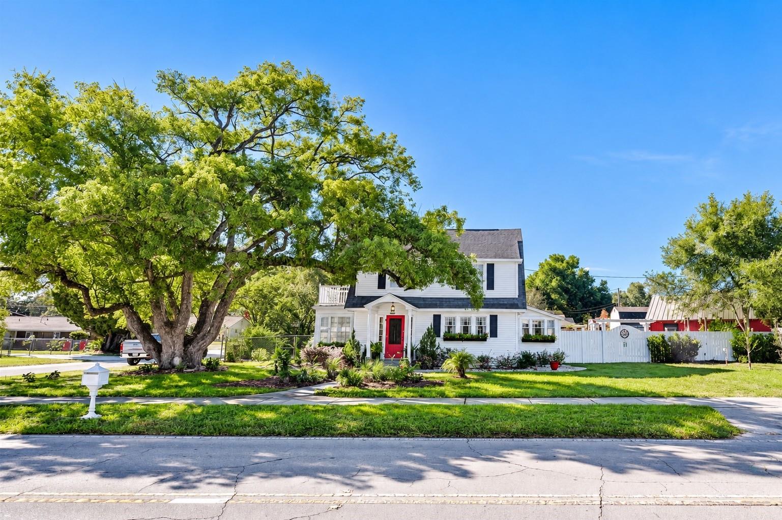 Charming farmhouse situated on an expansive .34-ACRE CORNER LOT, featuring a spacious FENCED BACKYARD, a BARN WITH ELECTRICITY, and an incredible variety of EDIBLE FRUIT TREES, PLANTS, AND HERBS! Enjoy the beauty of mature trees, lush landscaping, and your very own backyard oasis, perfect for gardening, homesteading, and embracing a FARM-TO-TABLE LIFESTYLE right at home!