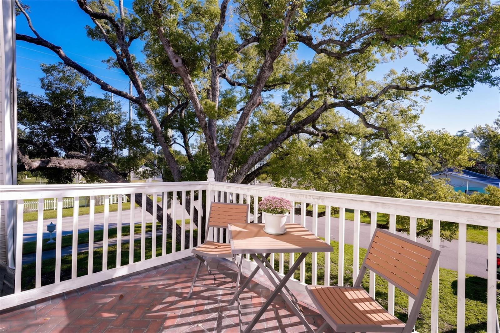 Step outside the UPSTAIRS PRIMARY BEDROOM onto your own charming PRIVATE BALCONY, the perfect retreat for enjoying morning coffee or relaxing with an evening beverage while taking in the beautiful views of mature oak trees and the peaceful surroundings!
