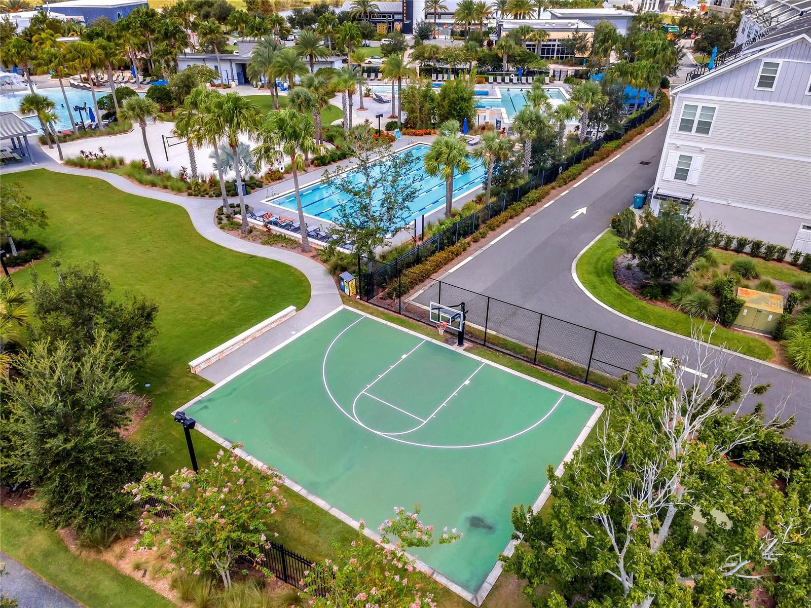 Aerial of community basketball court and pool area in Laureate Park, Lake Nona.