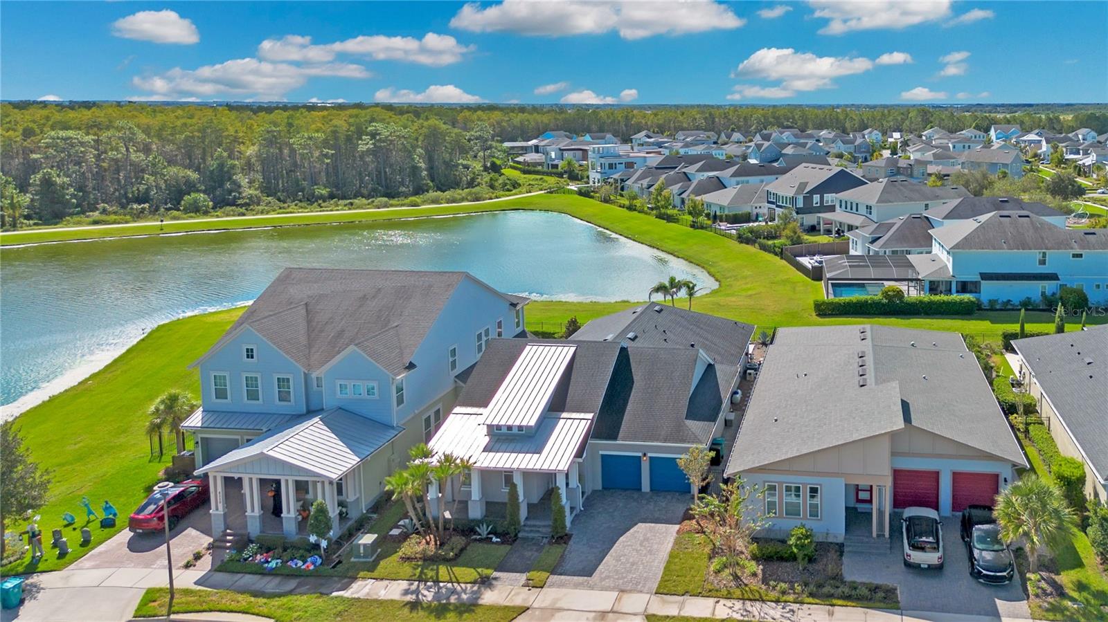 Aerial view of the home and pond frontage in Laureate Park, Lake Nona, Orlando FL 32827.