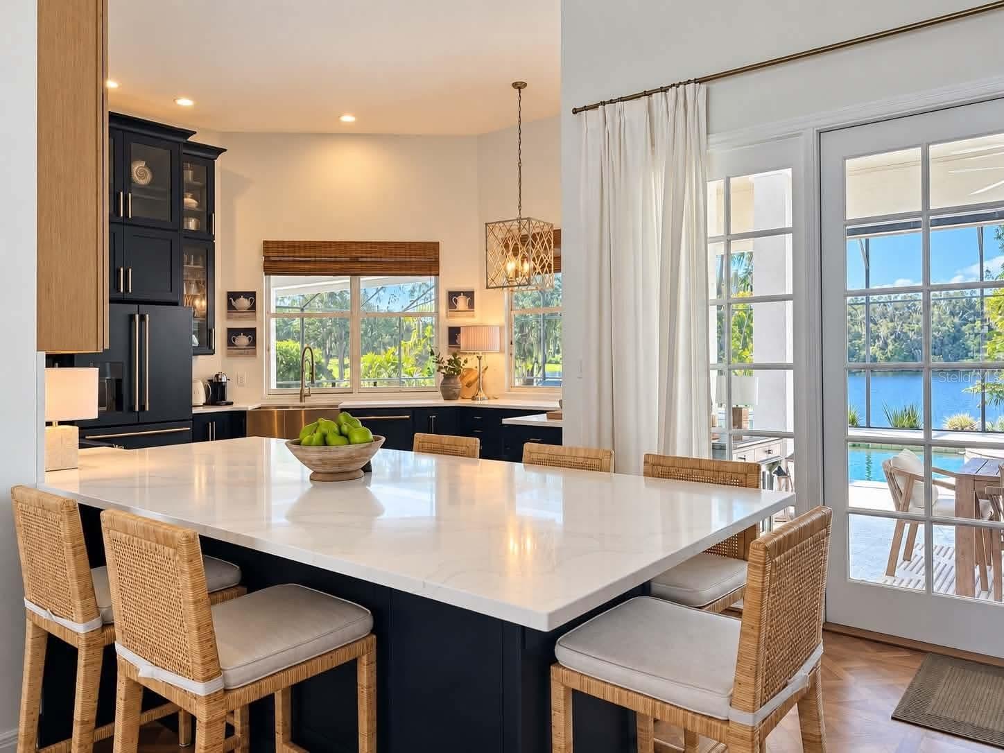 Giant kitchen island connects to family room