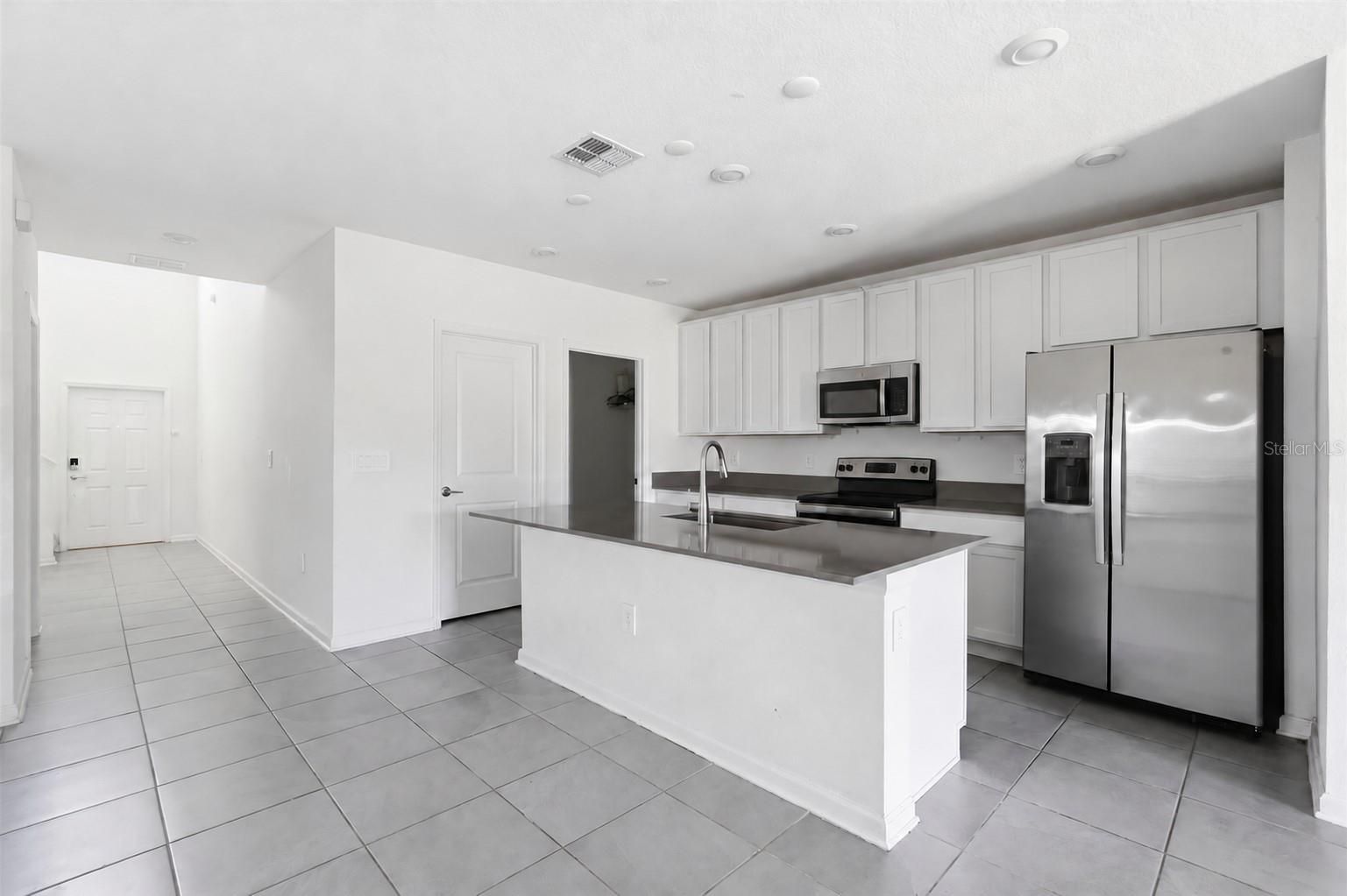 Kitchen comes with an island with stone counters