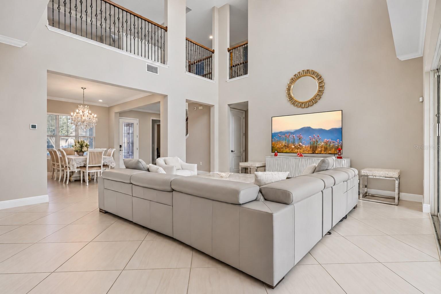 Two story living room with views of the catwalk.