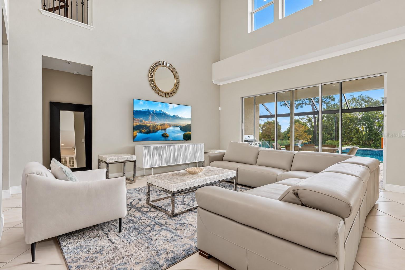 The two story living room makes a grand first impression.
